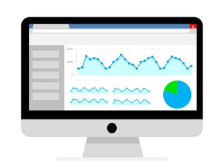 Illustration of a large computer monitor with a large line graph running across the top and four smaller line graphs and a circle graph below it.